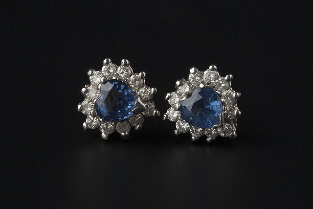 Appraisal: A PAIR OF SAPPHIRE AND DIAMOND CLUSTER EARSTUDS each heart-shaped