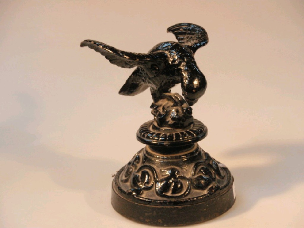 Appraisal: A Victorian cast iron figure of an eagle on a