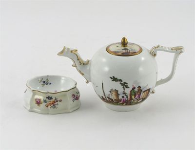 Appraisal: A Meissen teapot and cover painted with merchant figures in