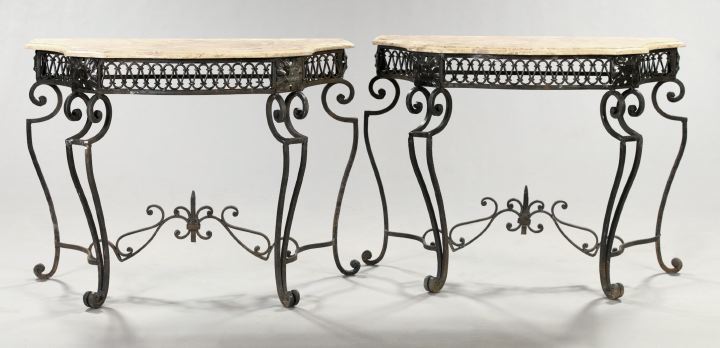 Appraisal: Pair of Mediterranean-Style Wrought-Iron and Marble-Top Console Tables the shaped