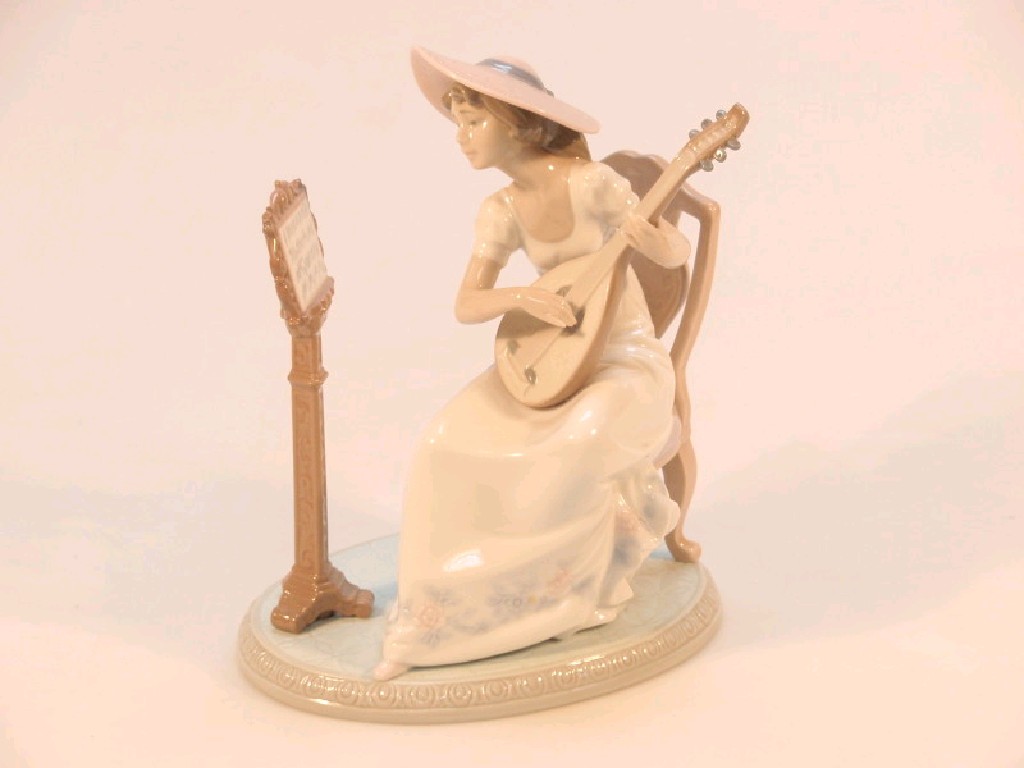 Appraisal: A Lladro figure of a young woman seated before a