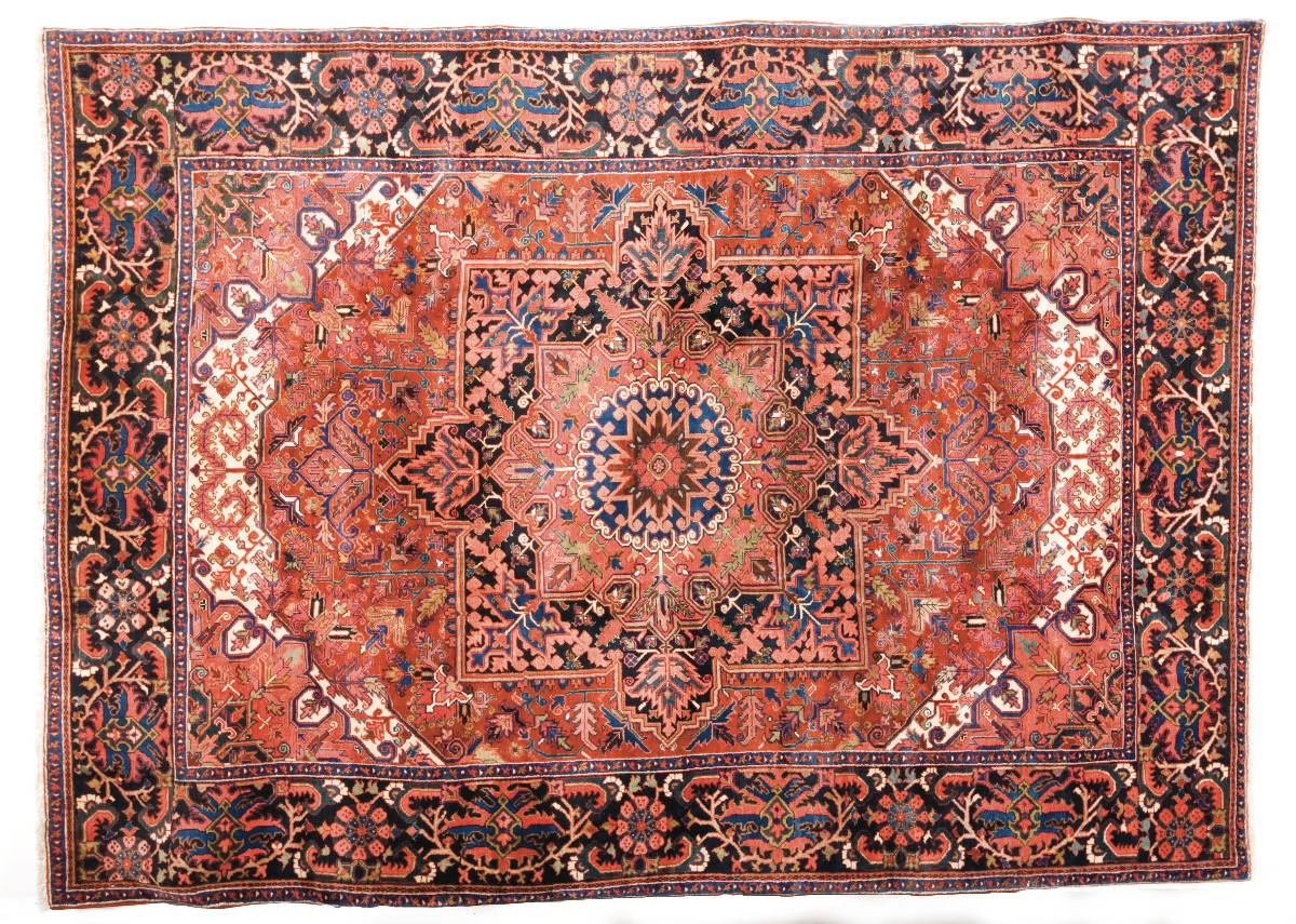 Appraisal: HERIZ CARPET NORTHWEST PERSIA CIRCA The indigo salmon and blue-black