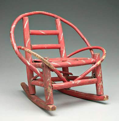 Appraisal: Child's painted twig rocking chair red paint with silver highlights