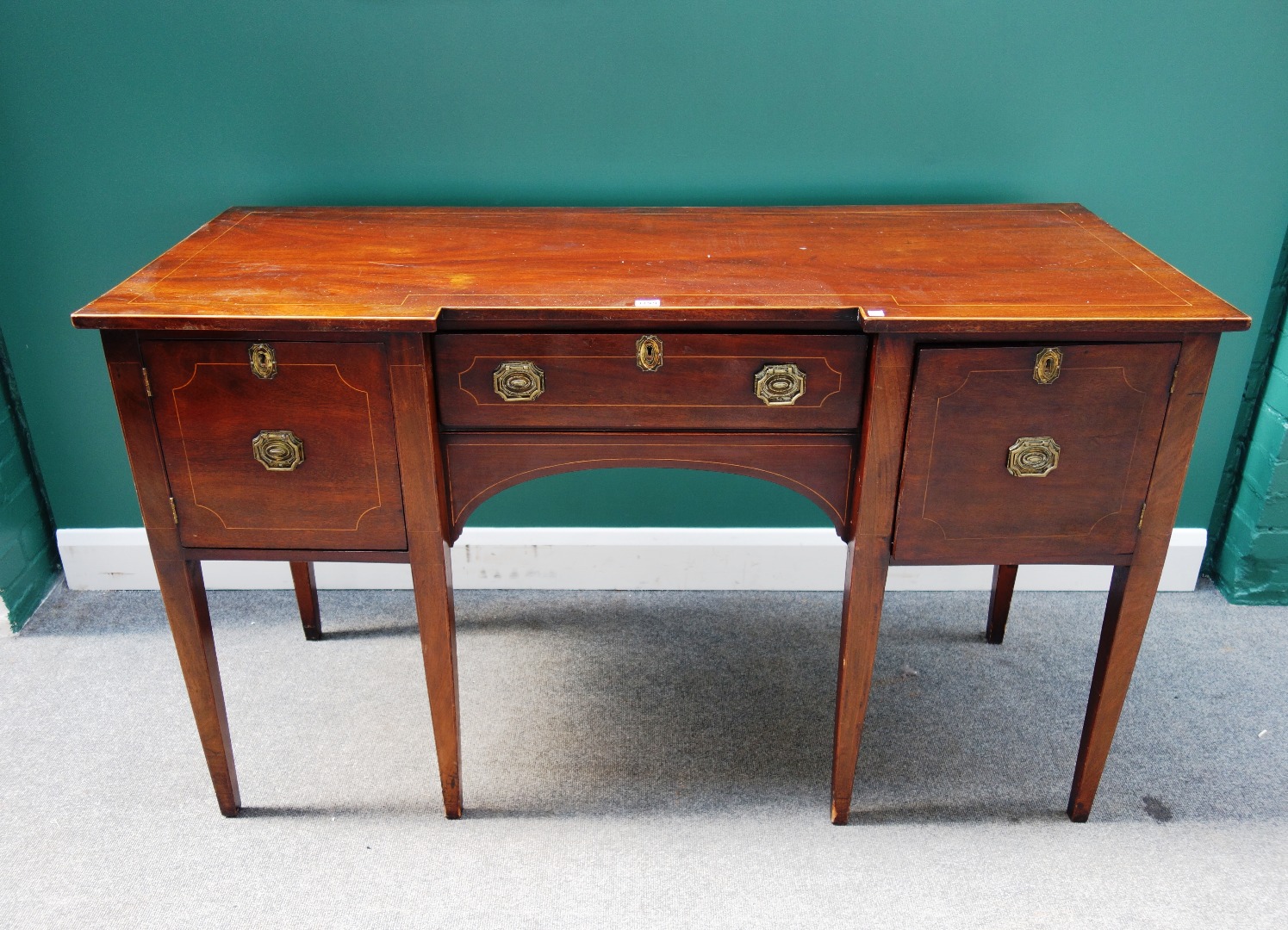 Appraisal: A th century inlaid mahogany inverted breakfront sideboard with three