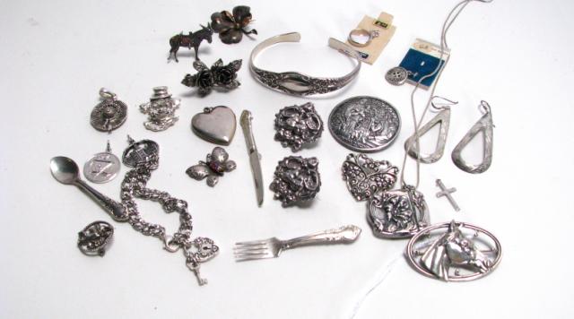 Appraisal: Collection of silver charms bracelets pins pendants and earrings