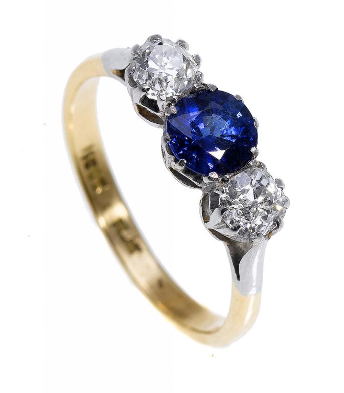 Appraisal: A SAPPHIRE AND DIAMOND THREE-STONE RING with slightly larger central