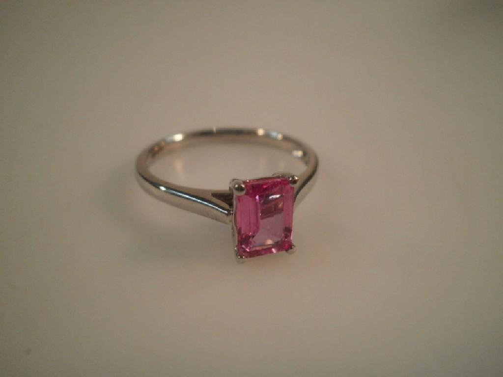 Appraisal: A trap cut pink stone stated pink sapphire set in