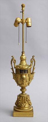 Appraisal: LOUIS XVI-STYLE GILT-BRONZE ROTATIONAL CLOCK MOUNTED AS A LAMP The