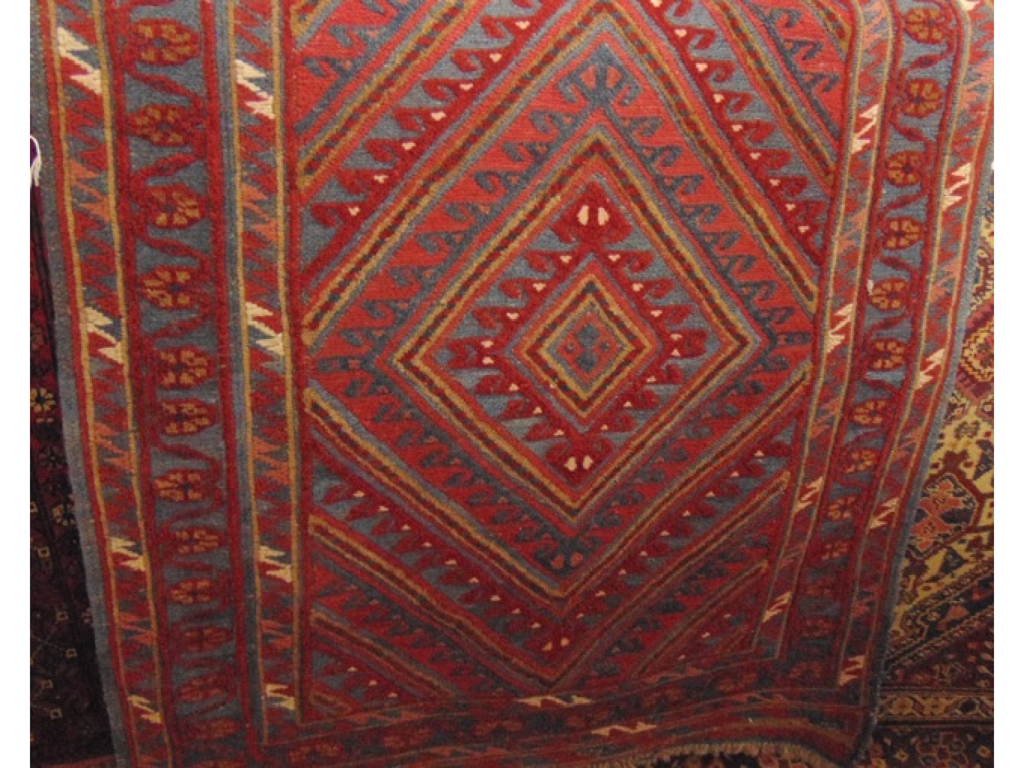 Appraisal: An Eastern wool rug with central medallion and within running