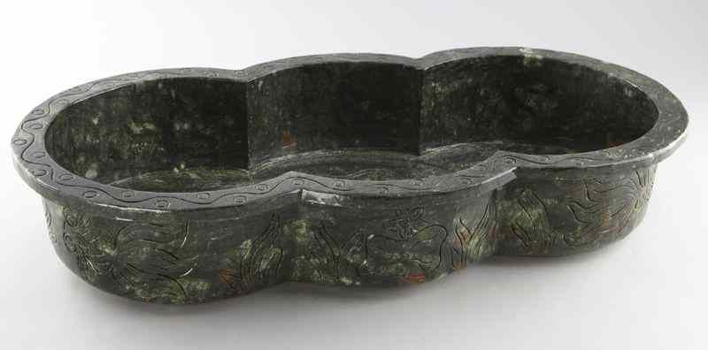 Appraisal: Large Chinese carved hard stone bowlof undulating form with incised