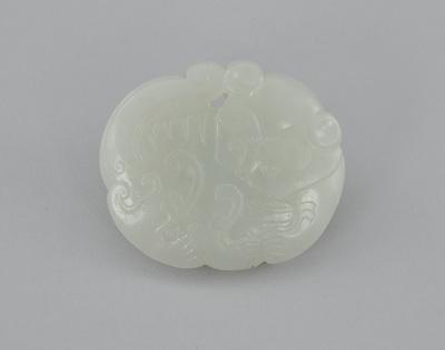 Appraisal: A Carved Jade Ornament Carved on both sides each depicting