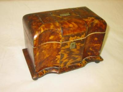 Appraisal: A TORTOISESHELL TEA CADDY of serpentine oblong form the lid