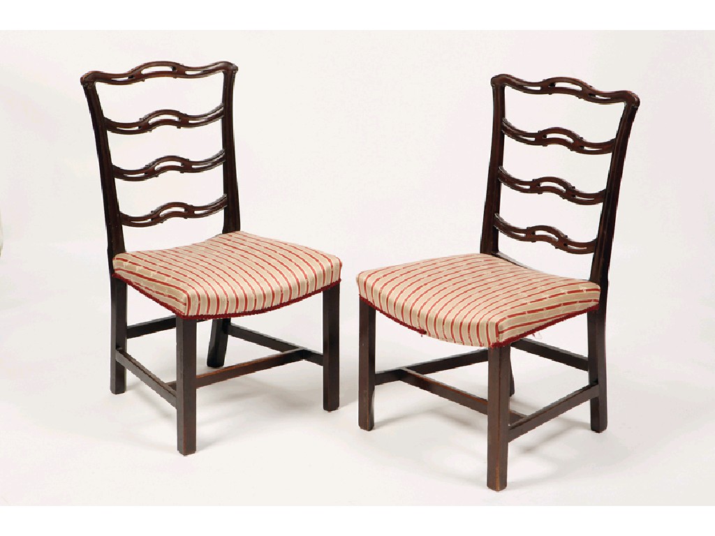 Appraisal: A PAIR OF GEORGE III MAHOGANY DINING CHAIRS with four