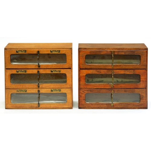 Appraisal: Two similar varnished light wood shop cabinets each of three