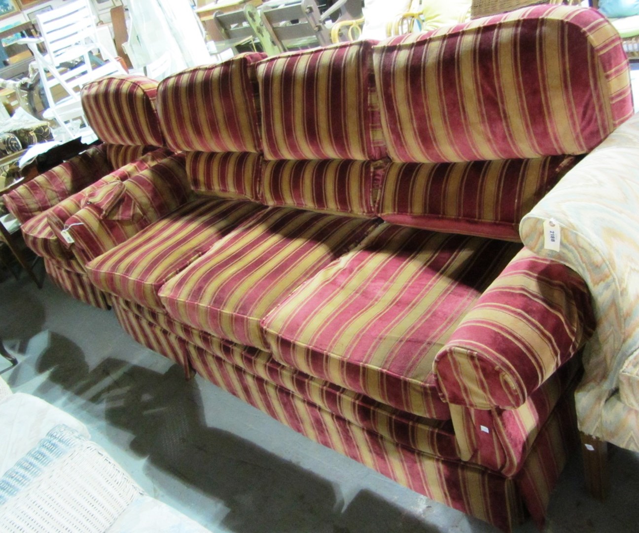 Appraisal: A th century red and gold striped three seat sofa