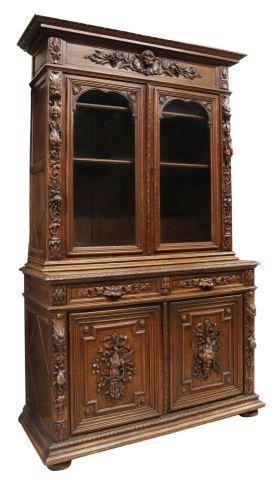 Appraisal: French relief carved oak hunt cabinet th c cornice top