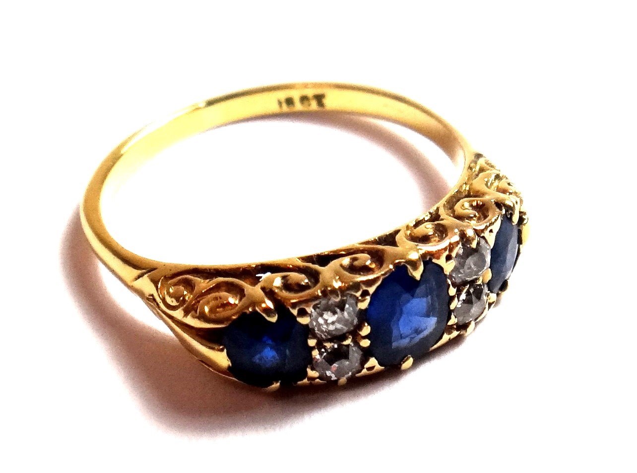 Appraisal: A gold sapphire and diamond set ring mounted with three