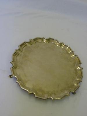 Appraisal: A SALVER of circular form with moulded Chippendale border raised