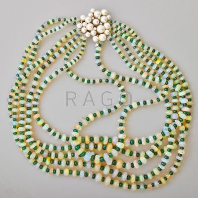 Appraisal: OPULENT OPAL AND EMERALD TORSADE Six concentric strands of alternating