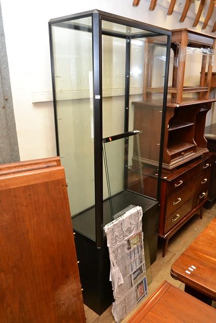 Appraisal: A GLAZED SHOP CABINET WITH SLIDING DOORS SHELVES A GLAZED