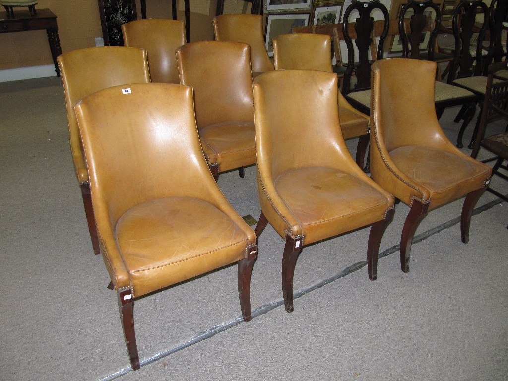 Appraisal: Set of leather upholstered dining chairs on sabre legs