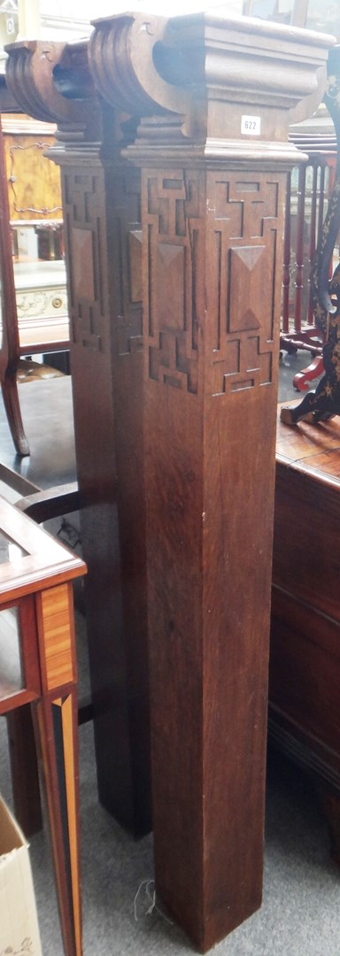 Appraisal: A pair of carved oak newel posts with scroll finials