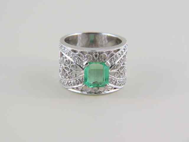 Appraisal: Emerald Diamond Ring carat emerald cut gem with diamonds totaling