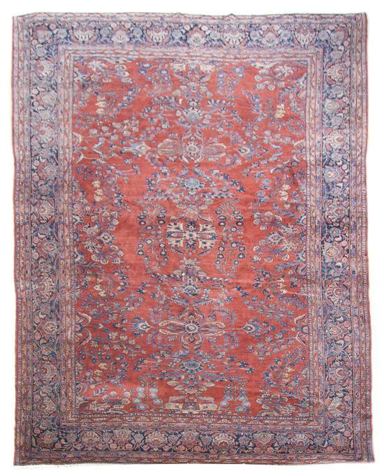 Appraisal: Sarouk Rug having floral decoration throughout with navy reserve in