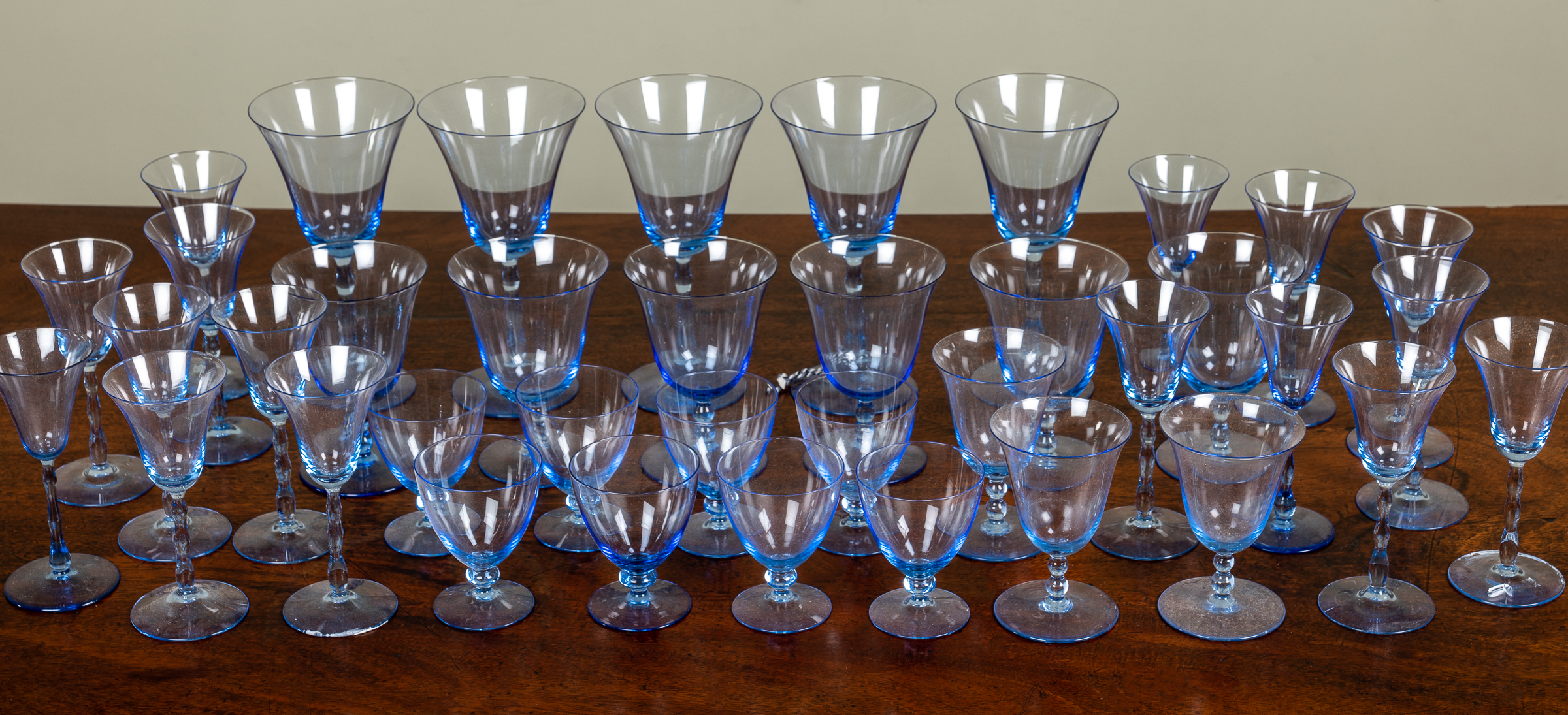 Appraisal: A suite of Venetian blue wine glasses in seven different