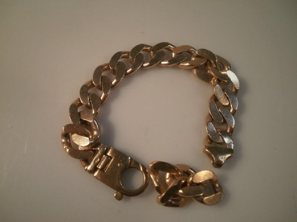 Appraisal: A yellow metal flat curb gentleman's bracelet stamped and four