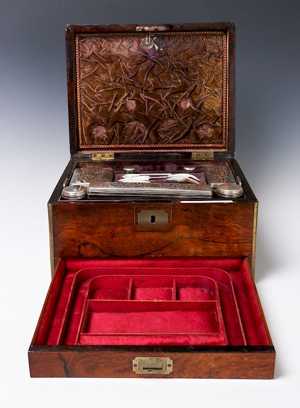 Appraisal: A VICTORIAN VANITY SET IN BRASS BOUND ROSEWOOD BOX A