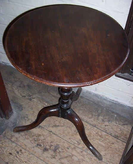 Appraisal: A th Century stained beech tripod table the circular top