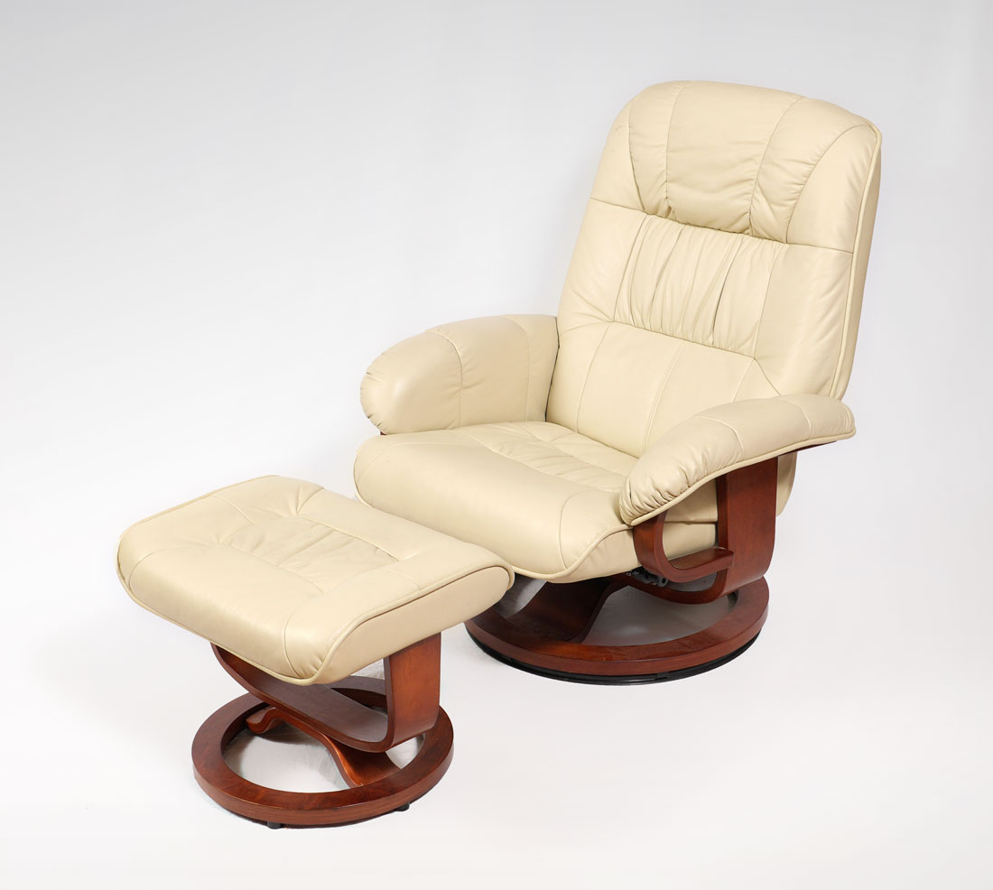 Appraisal: LEATHER RECLINING CHAIR AND FOOT STOOL In the style of