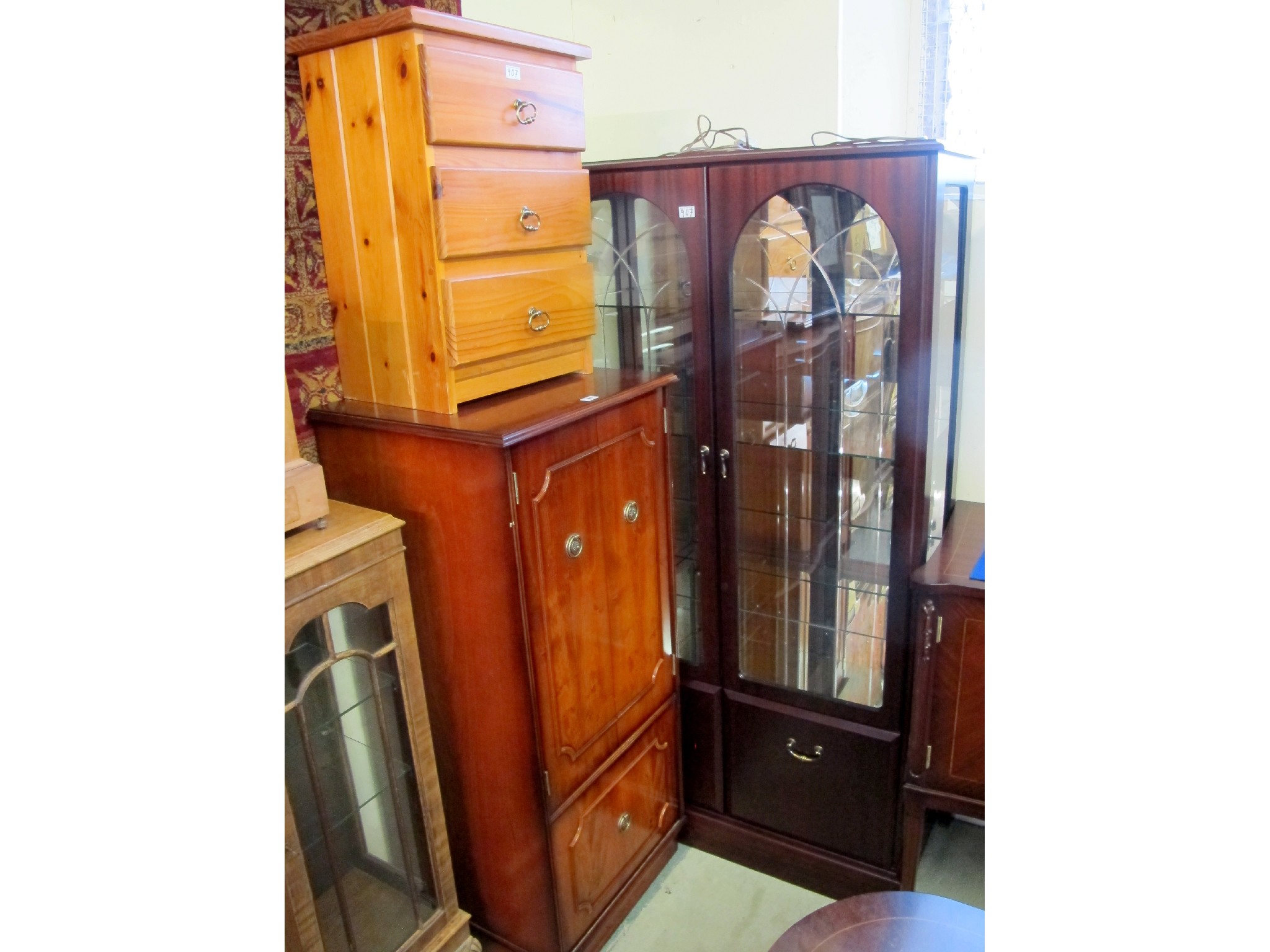 Appraisal: A th Century glazed display cabinet pine three drawer bedside