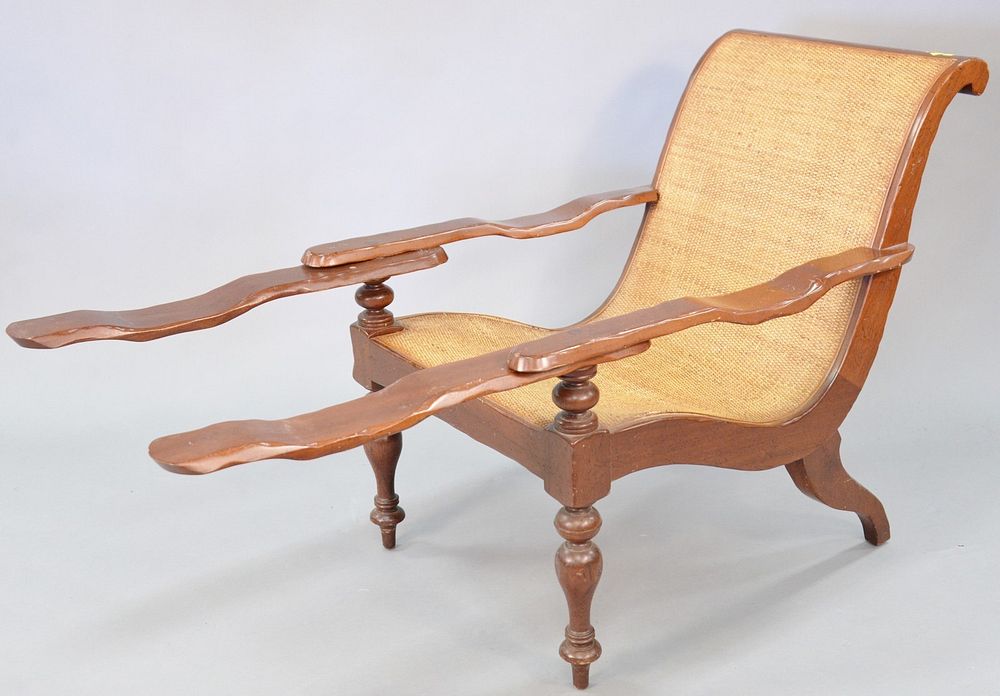 Appraisal: Plantation arm chair with swing arms and woven seat h