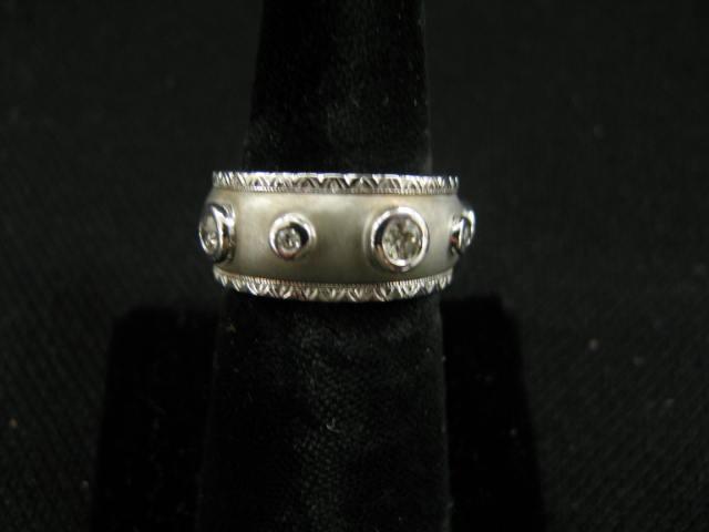 Appraisal: Diamond Band five round bezel set diamonds in k white