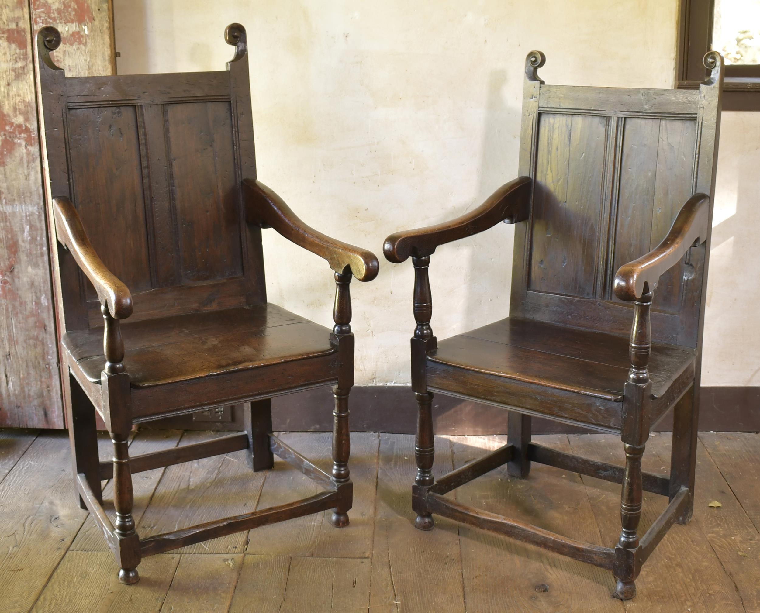 Appraisal: TWO SIMILAR TH C ENGLISH OAK ARM CHAIRS Two similar