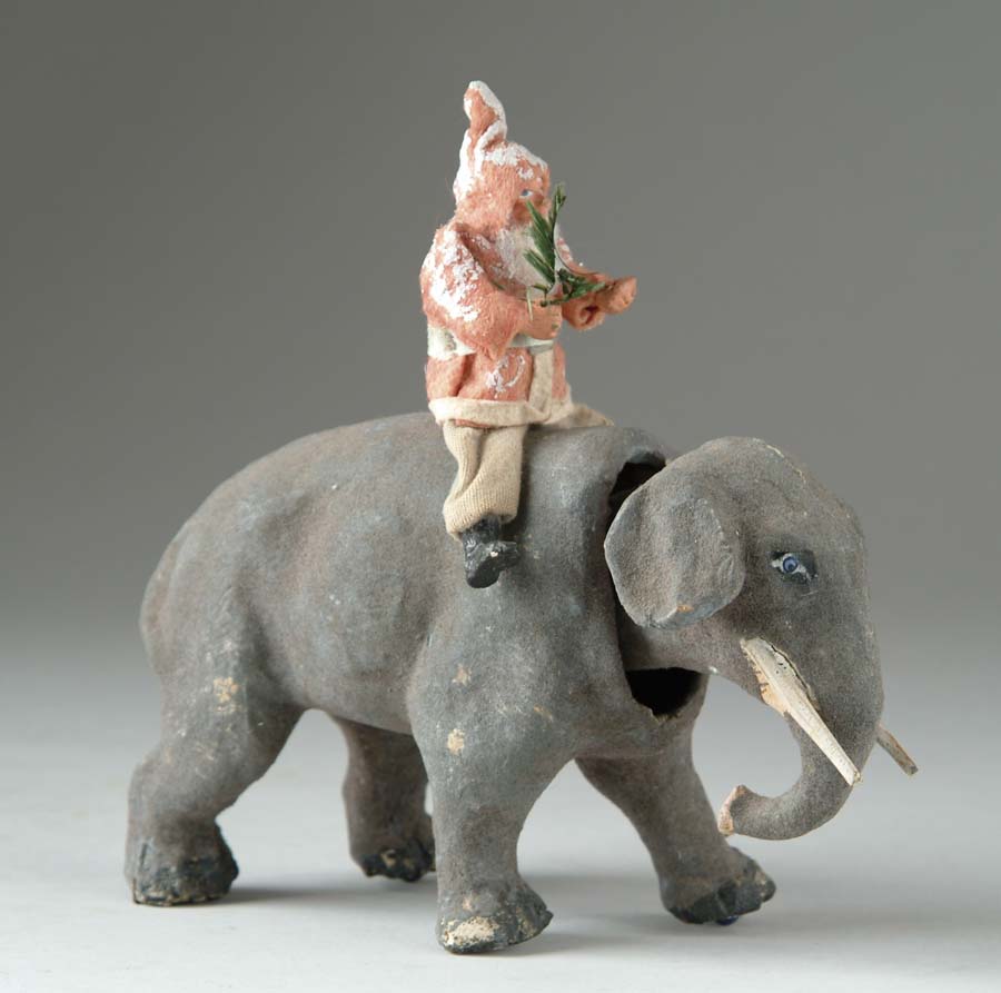 Appraisal: SANTA ON NODDING ELEPHANT Paper mache animal figure with hand-painted