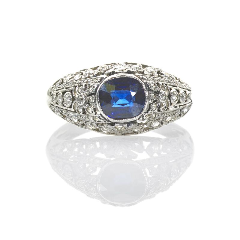 Appraisal: EDWARDIAN SAPPHIRE AND DIAMOND PLATINUM RING Hand-built reticulated platinum centrally