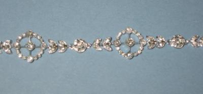 Appraisal: A DIAMOND BRACELET in the Edwardian style comprising pierced circular