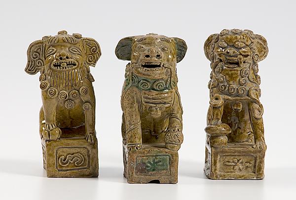 Appraisal: THREE CHINESE FOO DOG ARCHITECTURAL FAIENCE Three architectural faience Chinese