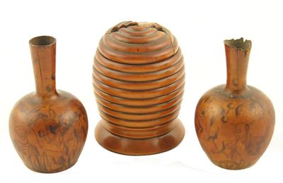 Appraisal: A pair of turned sycamore spill vases with penwork decoration