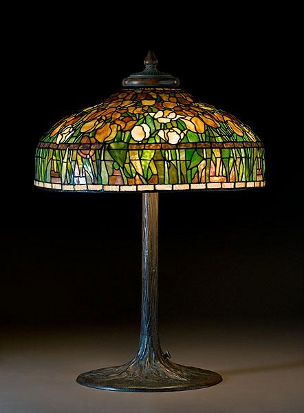 Appraisal: LEADED GLASS TULIP SHADE ON TIFFANY TREE TRUNK BASE American