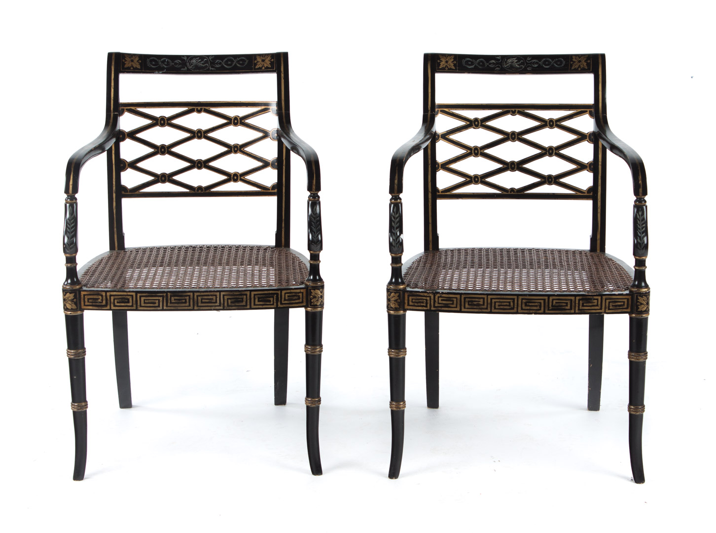 Appraisal: Pair of Regency style ebonized armchairs th century curved crest