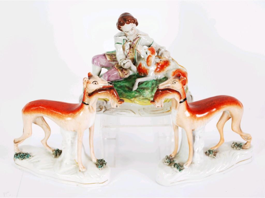 Appraisal: PAIR OF NINETEENTH CENTURY STAFFORDSHIRE EARTHENWARE FIGURE OF WHIPPETS with