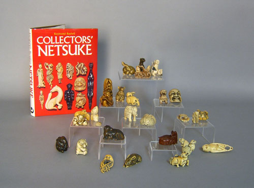 Appraisal: Group of twenty-seven Japanese netsuke together with a netsuke reference