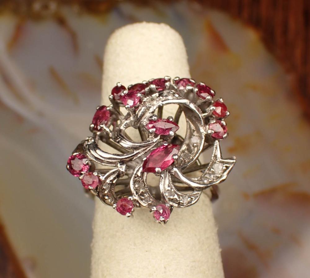 Appraisal: ESTATE PALLADIUM RING WITH RUBIES AND DIAMONDS set with three