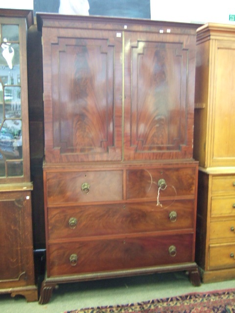 Appraisal: A mid th century mahogany linen press the plain cornice