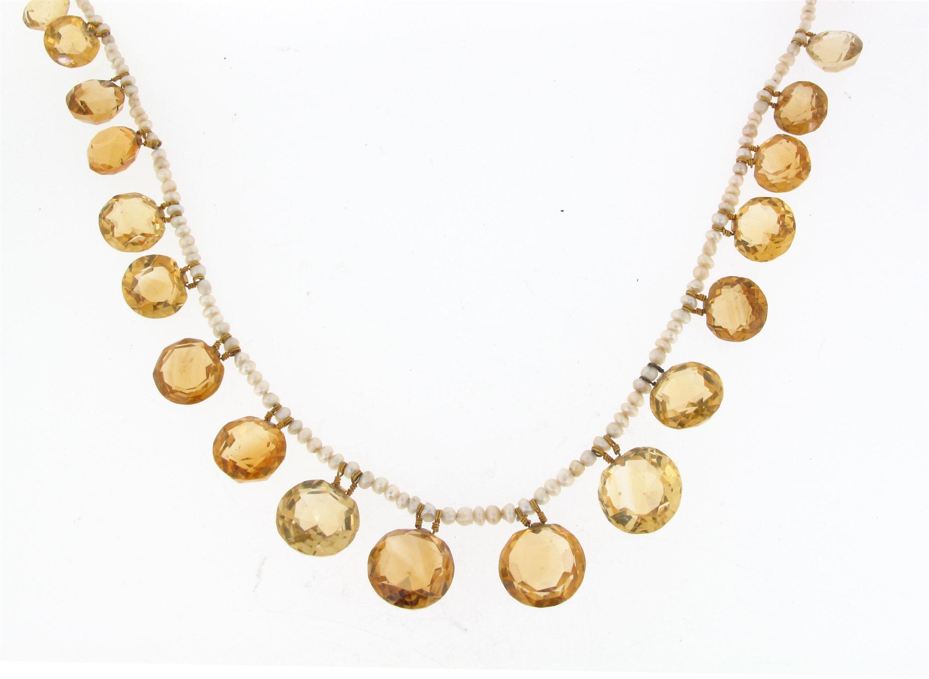 Appraisal: A seed pearl necklace suspending graduated faceted citrine pendants