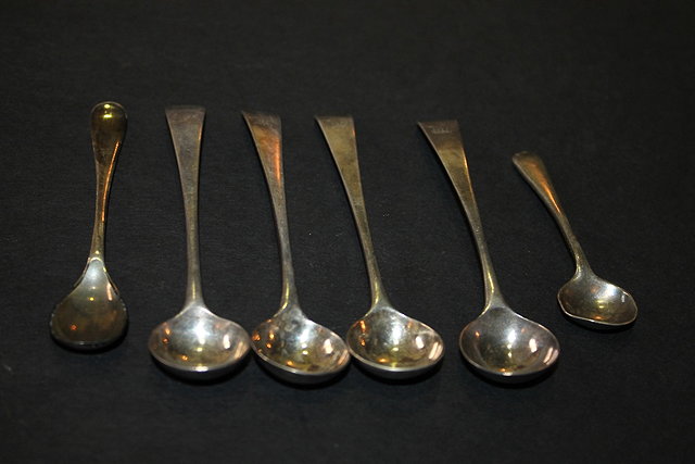 Appraisal: A COLLECTION OF FOUR GEORGIAN SILVER OLD ENGLISH PATTERN MUSTARD